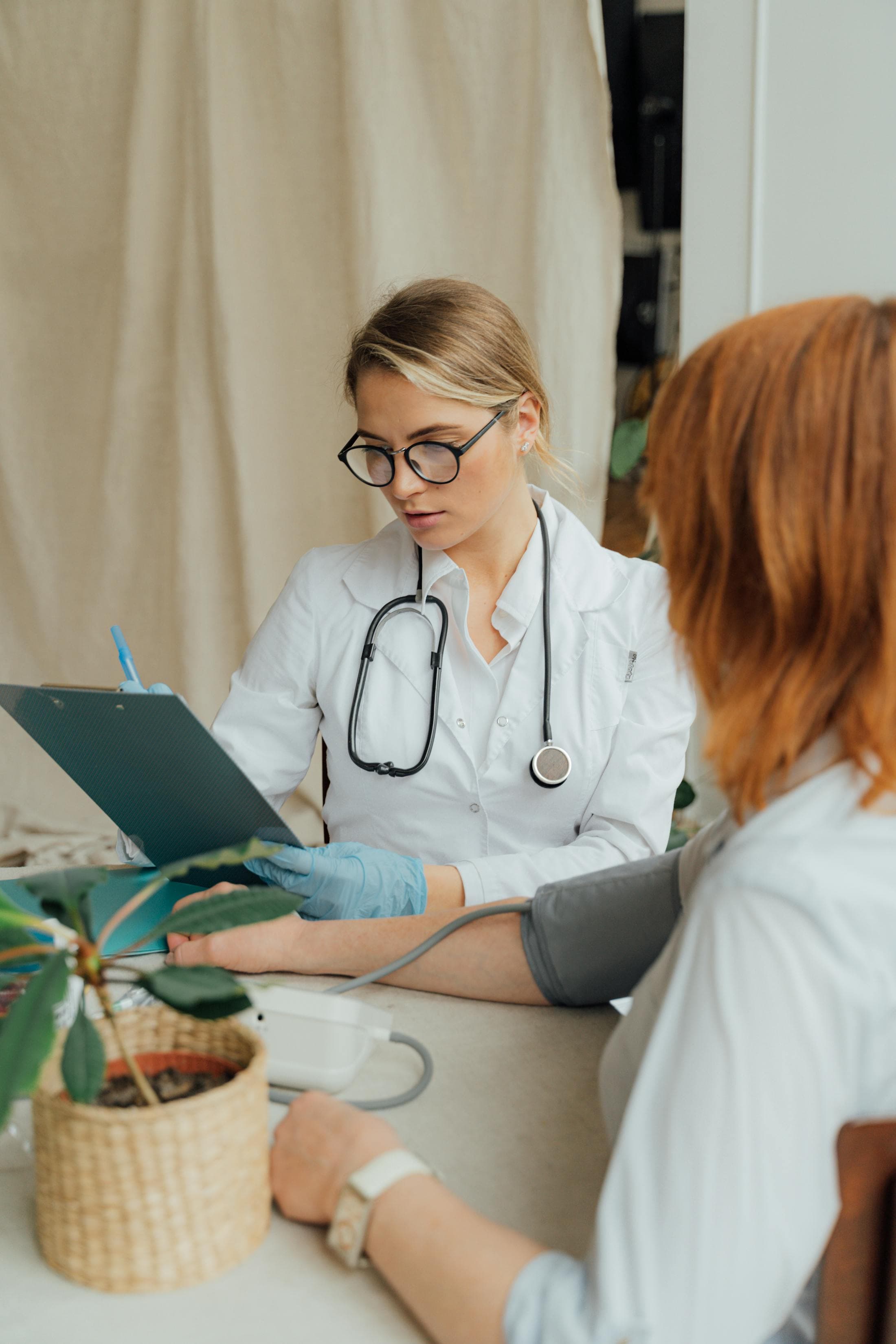 Doctor consulting with a patient in a modern clinical office.